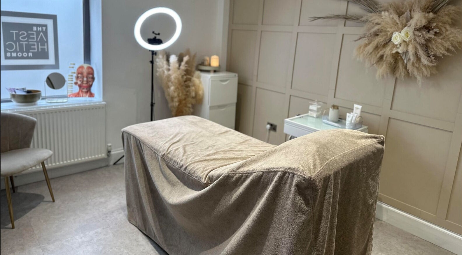 A tranquil beauty room at The Aesthetic Rooms, Rochdale, England, GB, featuring a spa bed and elegant decor.