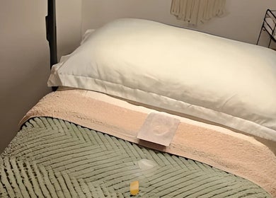 Relaxing massage table at Healing Hands Studio, Southampton, GB, adorned with soft linens.