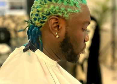 A stylish hairstyle in bright colors at Nana Rulz, Cape Town, Western Cape, ZA.