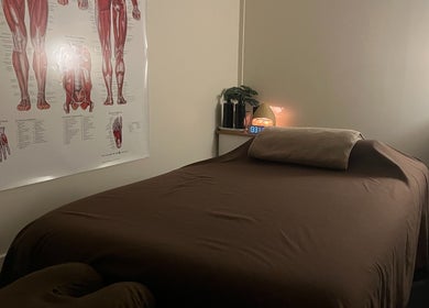 Cozy massage room at R.G Motion Therapy, Claremont Meadows, New South Wales, AU, featuring anatomical poster.