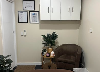 Cozy therapy room at R.G Motion Therapy, Claremont Meadows, NSW, AU with plush chair and serene decor.