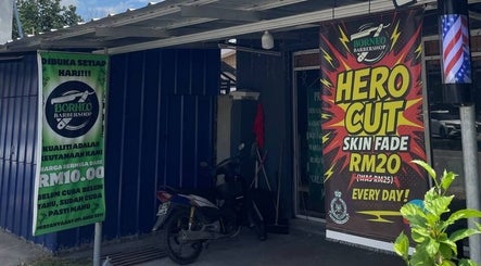 Borneo Barbershop Sabindo exterior in Penampang, Sabah, MY with colorful Hero Cut signs.