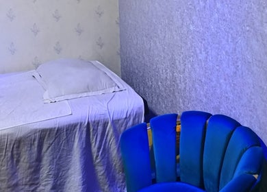 Relaxing spa room at Frozen Thai Spa - Spa in Dhaka, featuring a cozy bed and chair. Dhaka, Dhaka Division, BD.