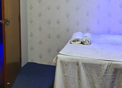 Relaxing spa room at Frozen Thai Spa - Spa in Dhaka, located in Dhaka, Dhaka Division, BD, with massage table.
