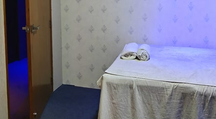 Relaxing spa room at Frozen Thai Spa - Spa in Dhaka, located in Dhaka, Dhaka Division, BD, with massage table.