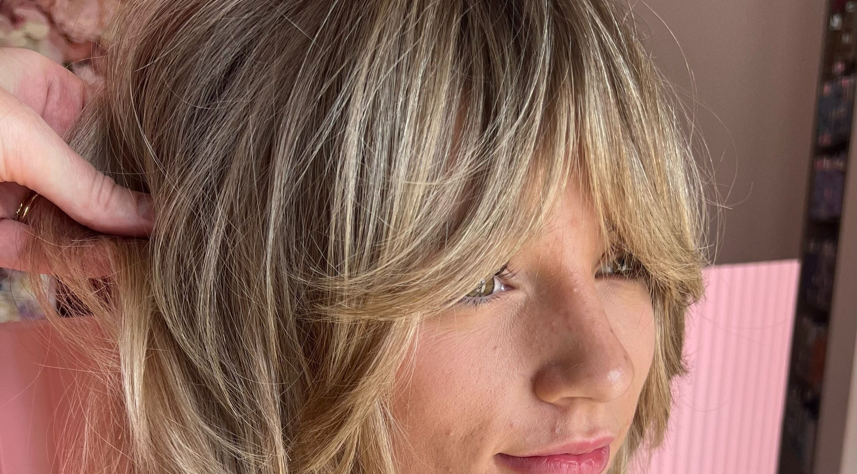 Blonde hair with layered fringe styled at Growth Salon, Fadden, Australian Capital Territory, AU.