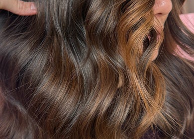 Beautiful wavy brown hair styled at Growth Salon in Fadden, Australian Capital Territory, AU.