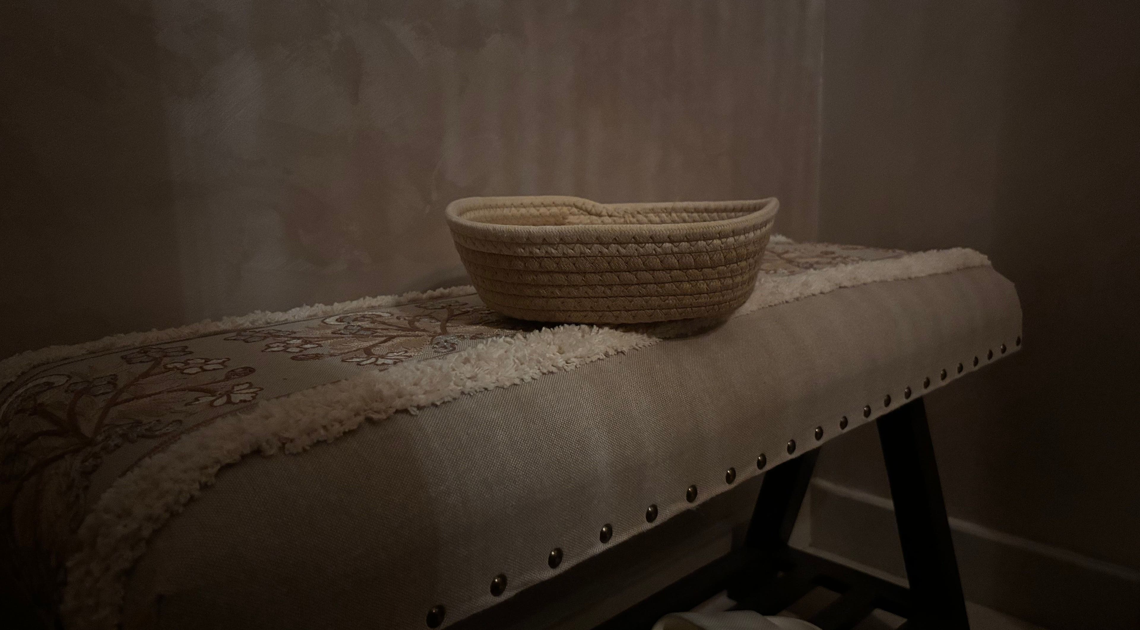 Cozy spa decor with a woven basket at Glow Day, Riyadh, Riyadh Province, SA.