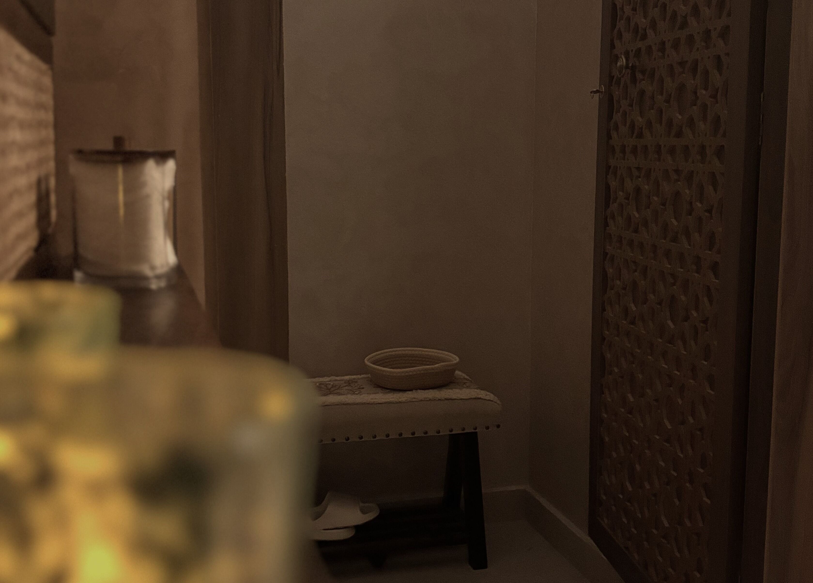 Tranquil spa corner inside Glow Day, Riyadh, Riyadh Province, SA, featuring soft lighting and elegant décor.