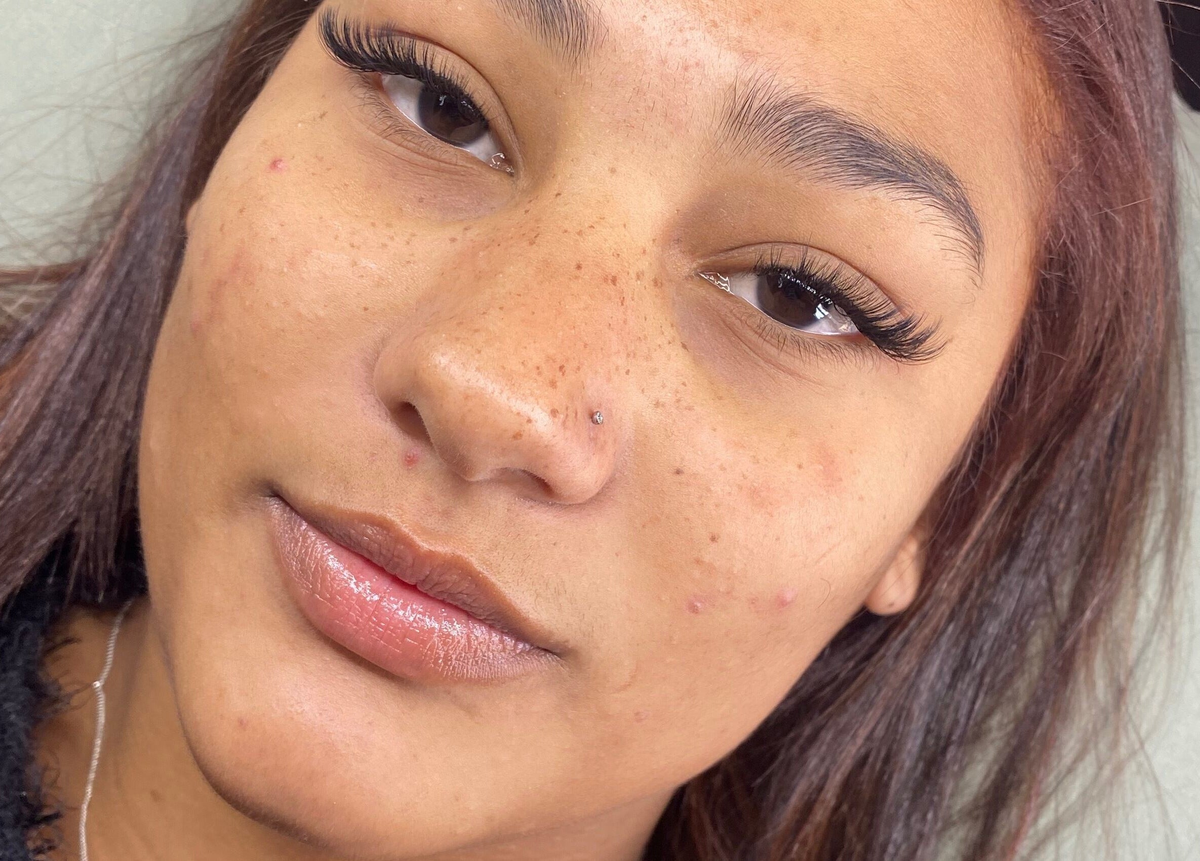 Close-up of a woman with expertly done lashes at Lashed by CD, Cape Town, Western Cape, ZA.