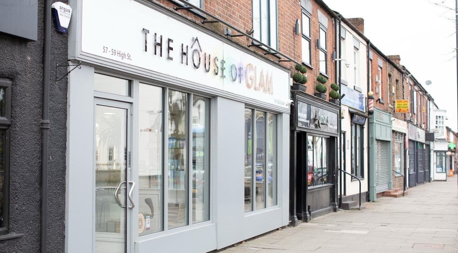 The House of Glam entrance on High St, Newton-le-Willows, England, GB, showcasing modern style.