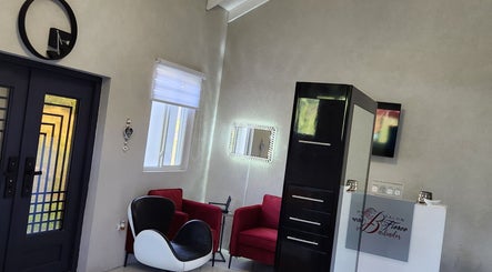 Modern lounge area at B Fierce Salon Barbados in Deanes, Saint James, BB featuring stylish chairs and decor.