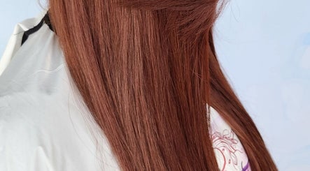Smooth chestnut hair styled at B Fierce Salon Barbados, Deanes, Saint James, BB, showcasing sleek salon finish.