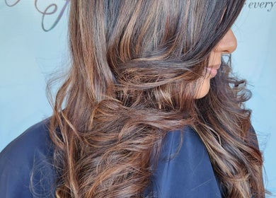 Stylish curled hair at B Fierce Salon Barbados, Deanes, Saint James, BB. Perfect for a trendy look.
