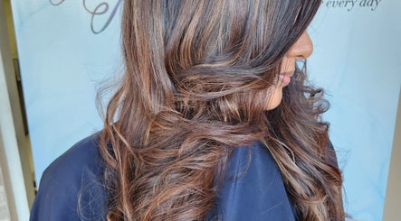 Stylish curled hair at B Fierce Salon Barbados, Deanes, Saint James, BB. Perfect for a trendy look.