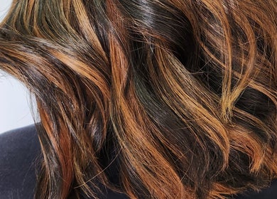 Rich brown highlights on flowing waves at B Fierce Salon Barbados, Deanes, Saint James, BB.