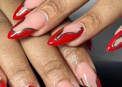 Stunning red and gold nail art at Leetalia nails & beauty, Randburg, Gauteng, ZA.