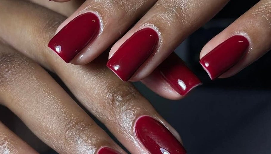 Elegant red manicure at Leetalia nails & beauty, Randburg, Gauteng, ZA showcasing high gloss finish.