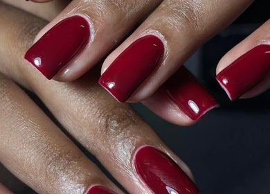 Elegant red manicure at Leetalia nails & beauty, Randburg, Gauteng, ZA showcasing high gloss finish.