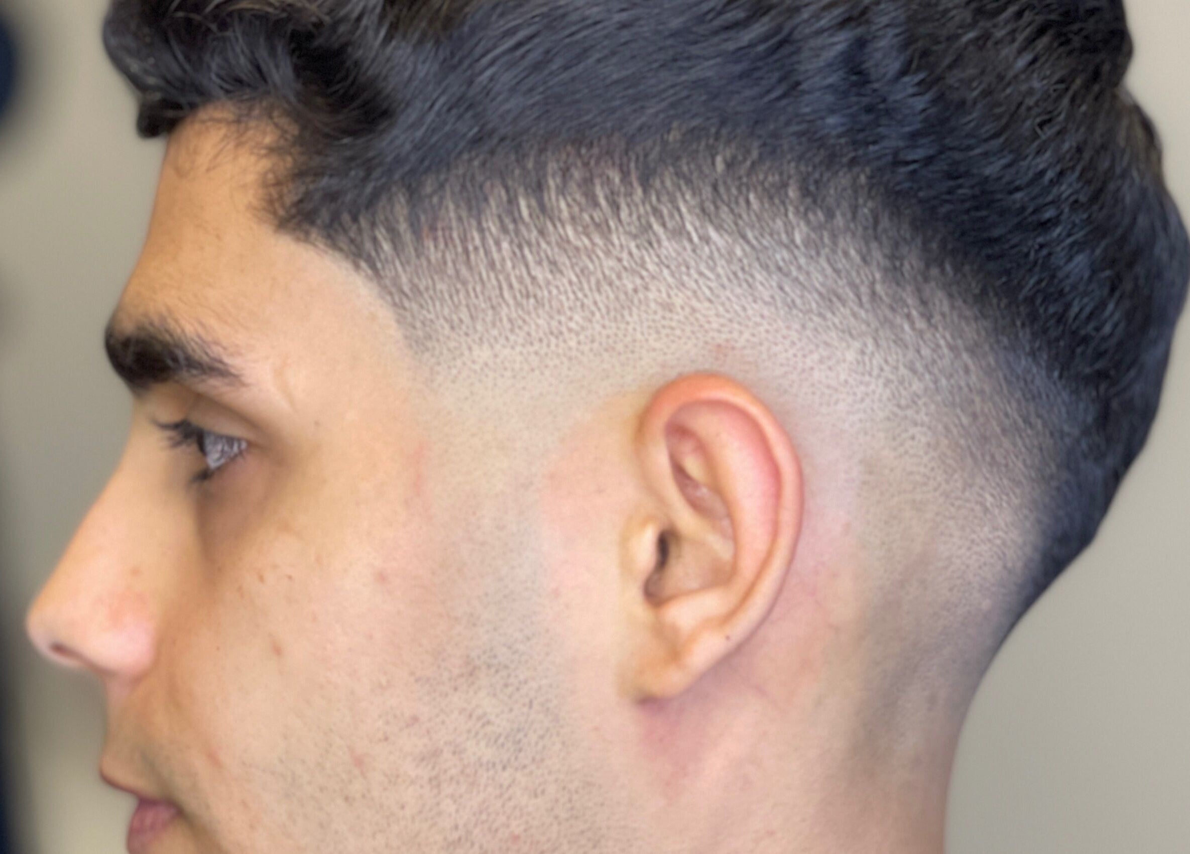 Close-up of a sleek fade haircut at Omar Alaseer, Amman, Amman Governorate, JO.