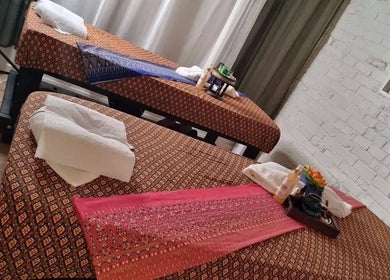 Relaxing massage beds at Reiya Thai Massage in Auckland, Auckland, NZ, featuring traditional Thai decor.