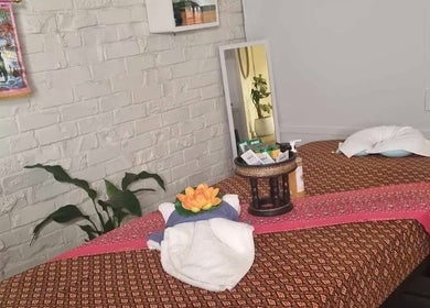 Relaxing massage room at Reiya Thai Massage, Auckland, NZ with serene decor and traditional aesthetics.