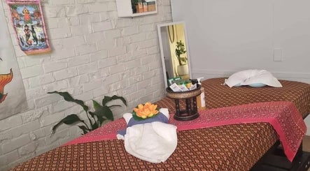 Relaxing massage room at Reiya Thai Massage, Auckland, NZ with serene decor and traditional aesthetics.