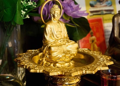 Golden Buddha statue at Chabaa Thai & Remedial Massage, Surry Hills, New South Wales, AU.