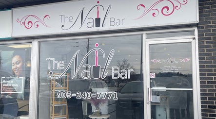 Front of The Nail Bar in Oshawa, Ontario, CA, showcasing elegant signage and services.
