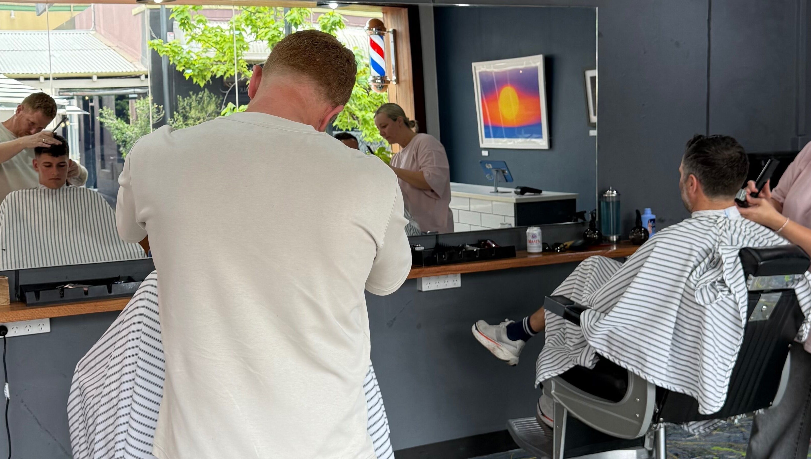 Haircut in progress at The Barbers Chair, Subiaco, Western Australia, AU. Professional barbers at work.