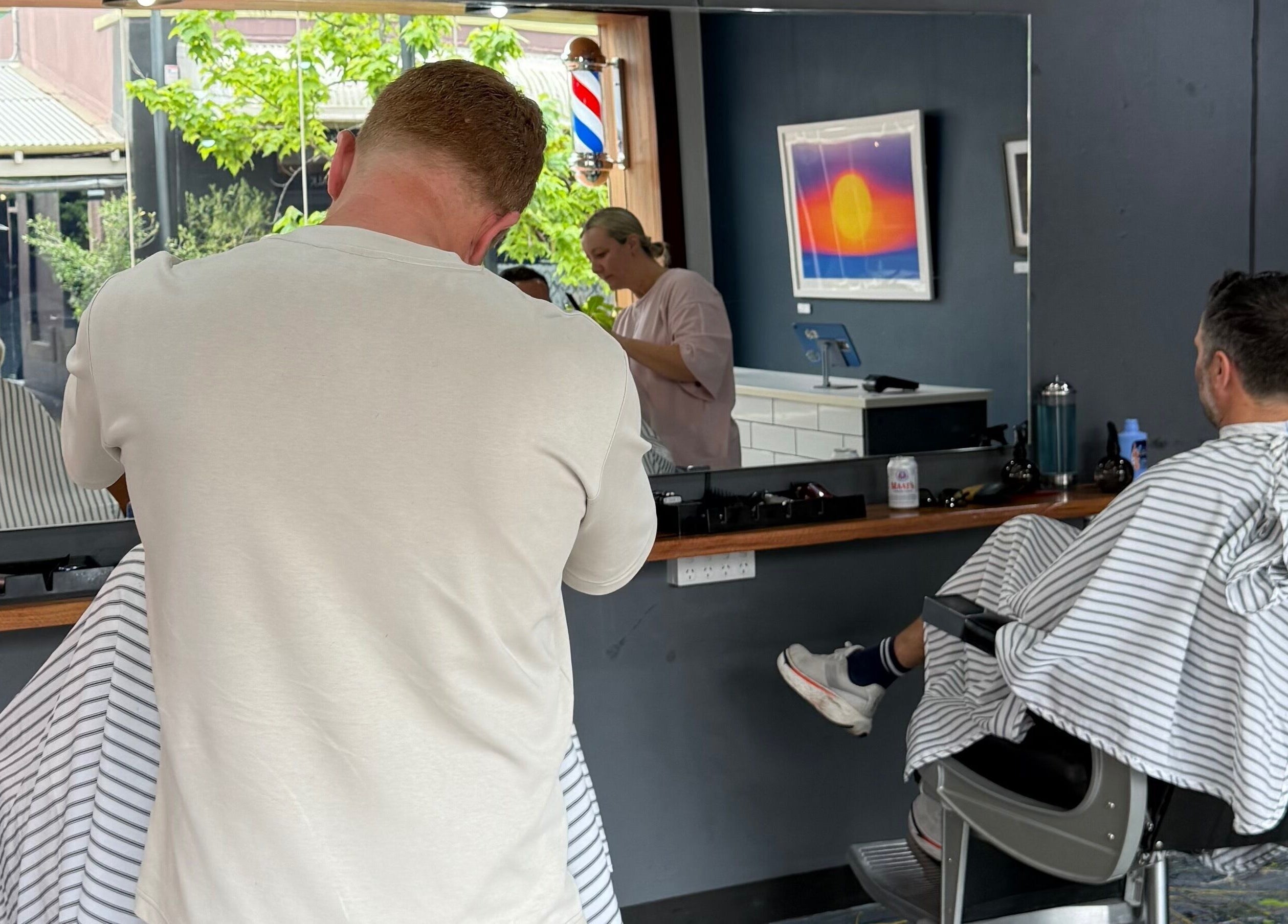 Haircut in progress at The Barbers Chair, Subiaco, Western Australia, AU. Professional barbers at work.