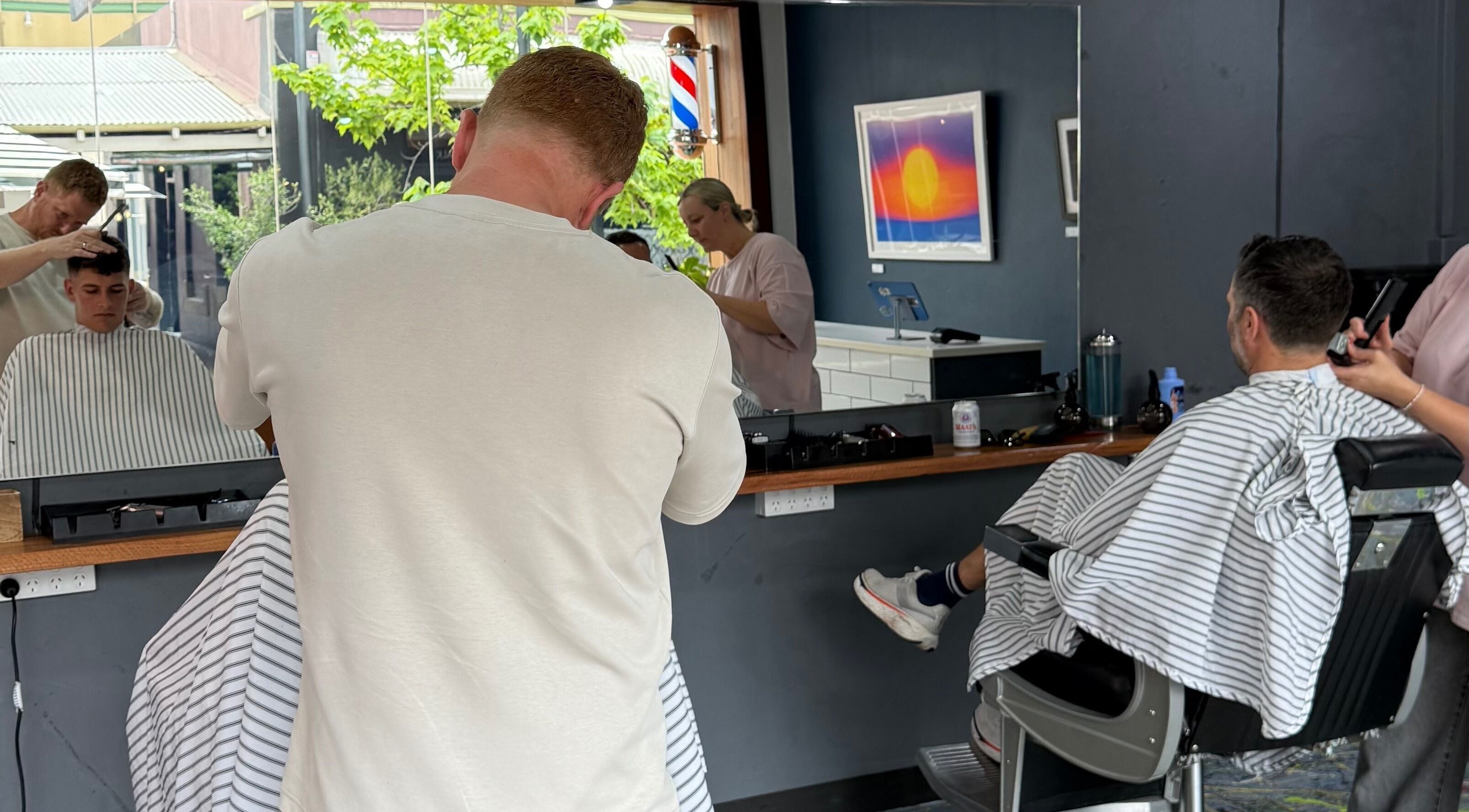 Haircut in progress at The Barbers Chair, Subiaco, Western Australia, AU. Professional barbers at work.