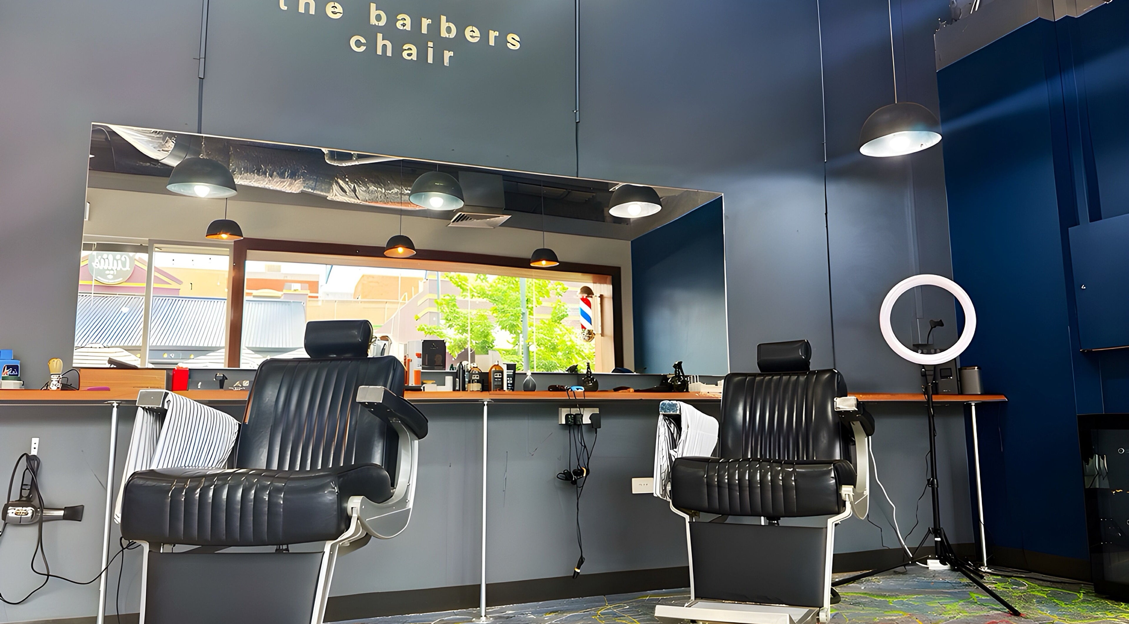 Interior of The Barbers Chair in Subiaco, Western Australia, AU with classic barber chairs and modern decor.