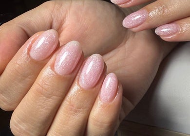 Sparkly pink nails at Blessed Nails, Kangaroo Point, Queensland, AU, showcasing expert manicure work.