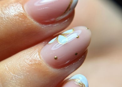 Close-up of artistic nail design with gold accents at Blessed Nails, Kangaroo Point, Queensland, AU.
