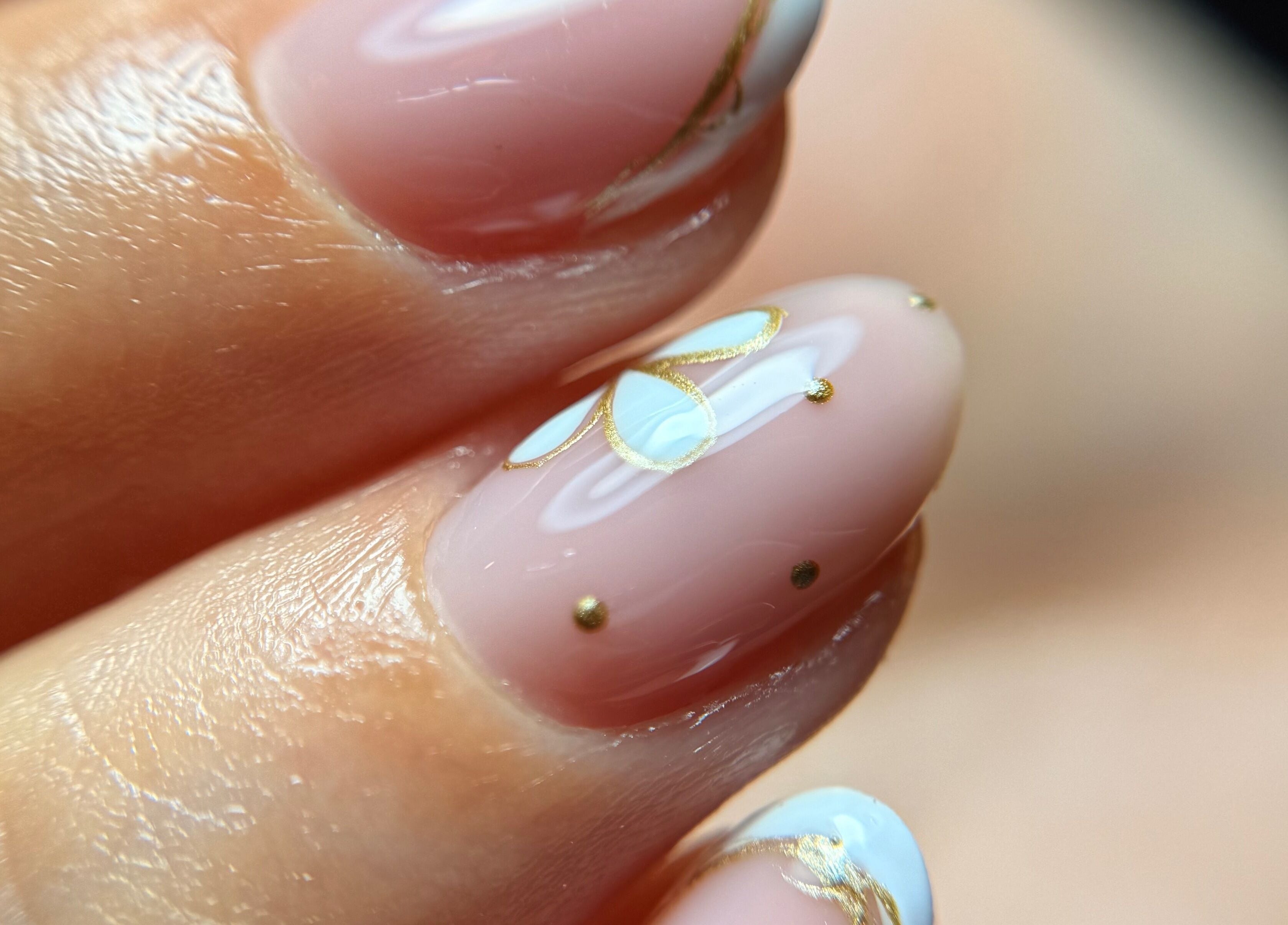 Close-up of artistic nail design with gold accents at Blessed Nails, Kangaroo Point, Queensland, AU.
