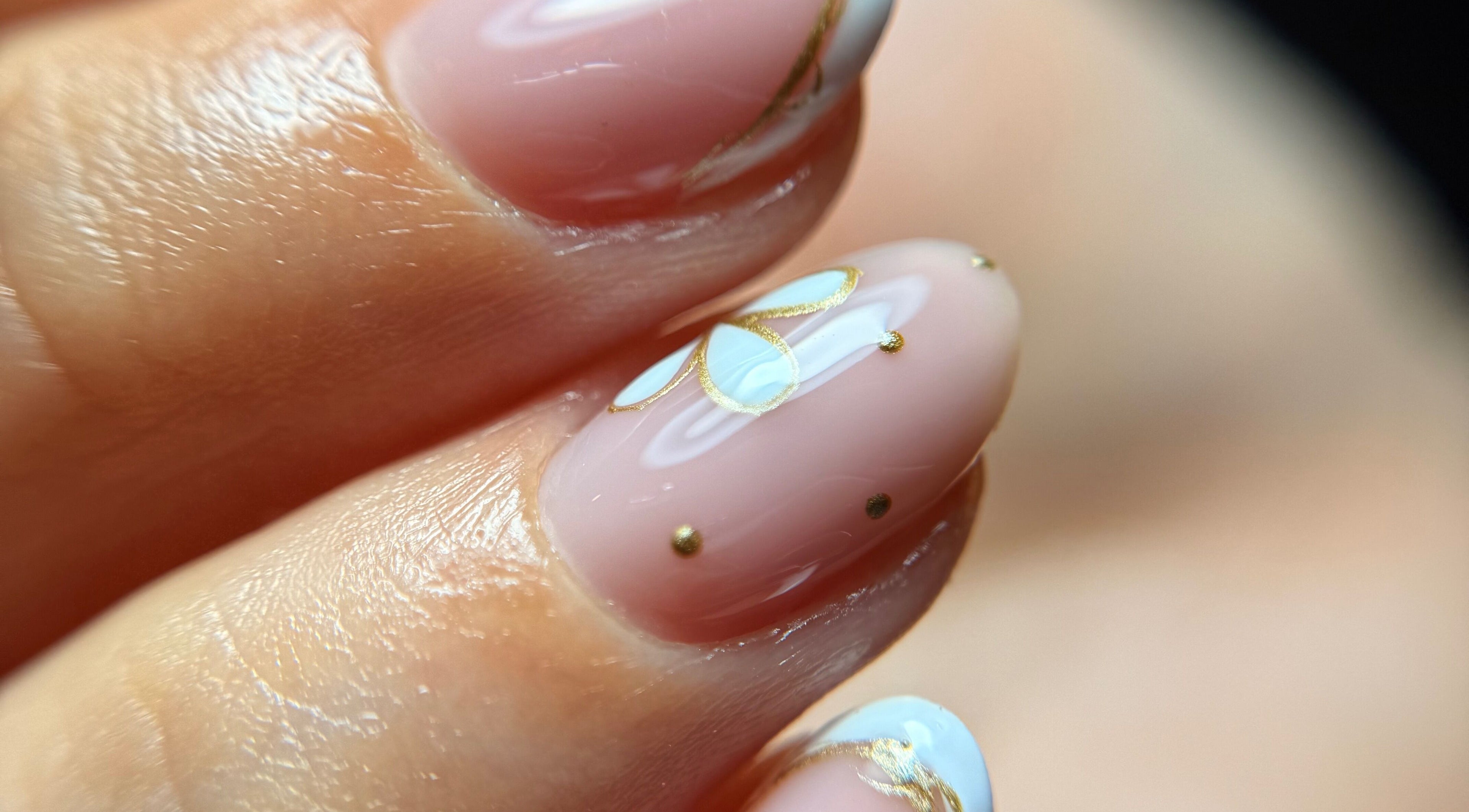 Close-up of artistic nail design with gold accents at Blessed Nails, Kangaroo Point, Queensland, AU.