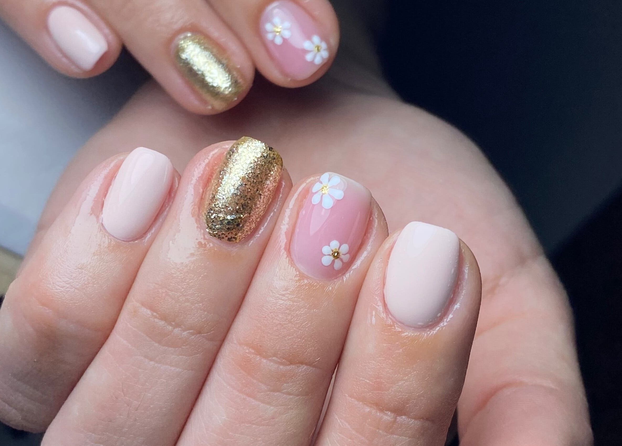 Elegant floral nail art with gold accents at Blessed Nails, Kangaroo Point, Queensland, AU.