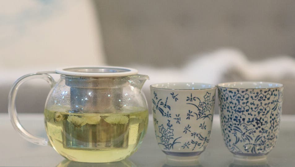 Glass teapot with floral cups at Maison de Linda Skin and Beauty, Richmond, Victoria, AU.