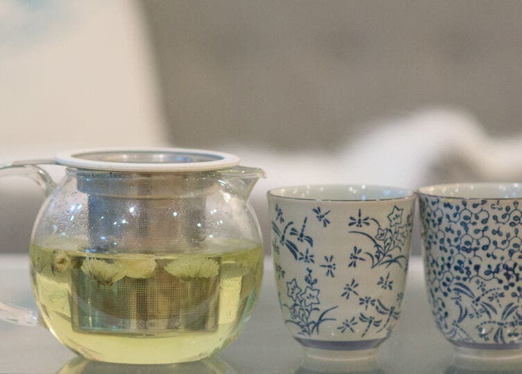 Glass teapot with floral cups at Maison de Linda Skin and Beauty, Richmond, Victoria, AU.