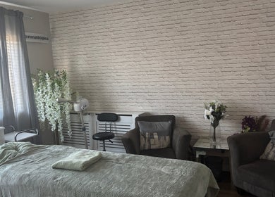 Calm treatment room at LEL’s Beauty in Tividale, England, GB, featuring a cozy bed and elegant decor.