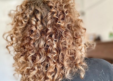 Elegant curly hairstyle crafted at Little Things Hair & Beauty, Heswall, England, GB.