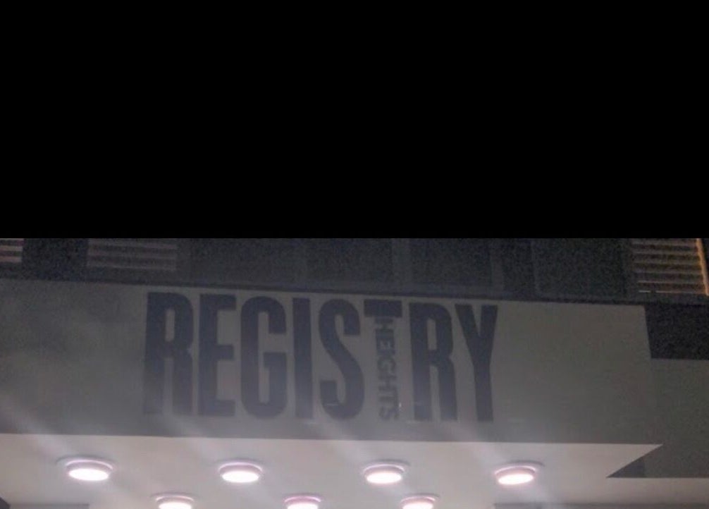 Gitedhands Glam entrance at night with illuminated sign in Beckenham, England, GB.