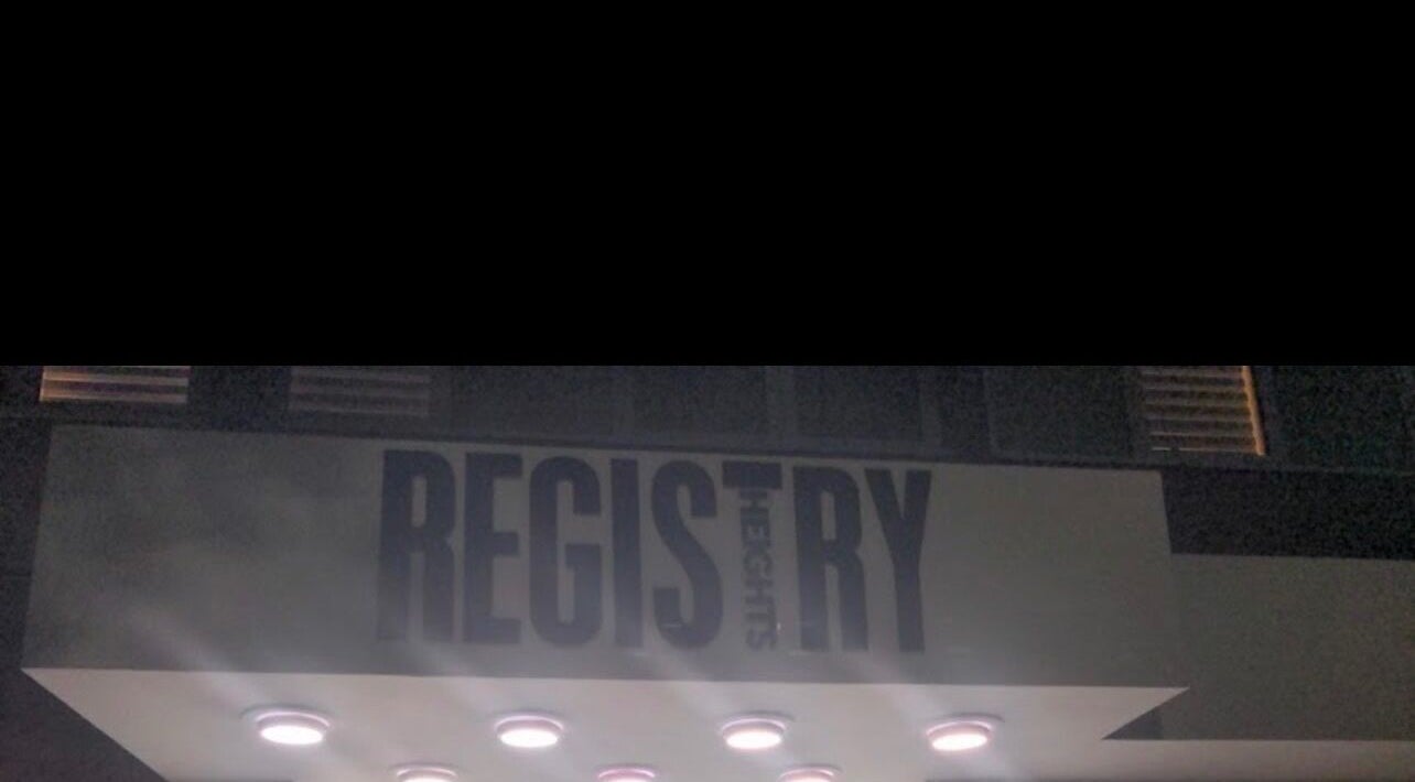 Gitedhands Glam entrance at night with illuminated sign in Beckenham, England, GB.