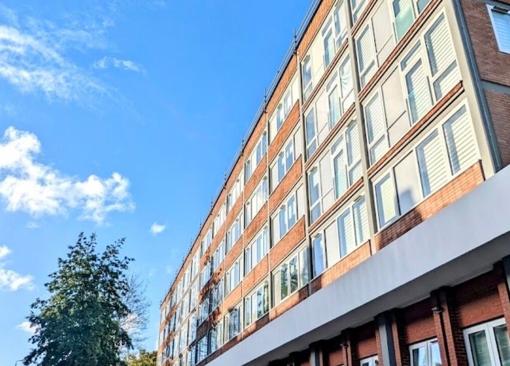 Gitedhands Glam venue exterior, modern facade in Beckenham, England, GB, against a bright blue sky.