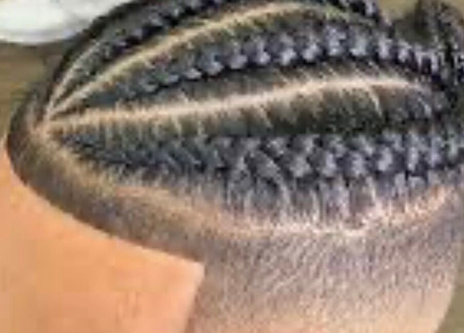 Intricate cornrows styled at Gitedhands Glam, Beckenham, England, GB for a modern look.