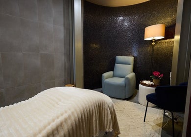 Relaxing massage room at Elena Massage Therapist in Paddington, New South Wales, AU with comfy chair and soft lighting.