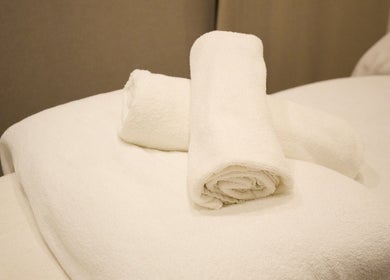 Soft rolled towels ready for relaxation at Elena Massage Therapist in Paddington, New South Wales, AU.