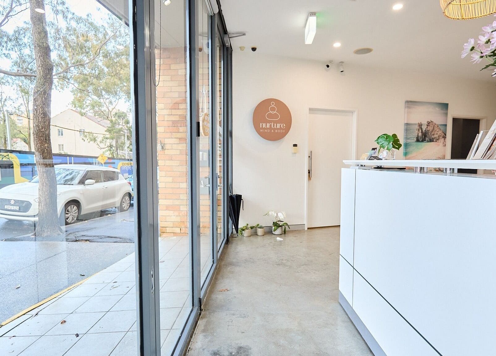 Modern reception area at Elena Massage & Bodywork in Paddington, New South Wales, AU with large window view.