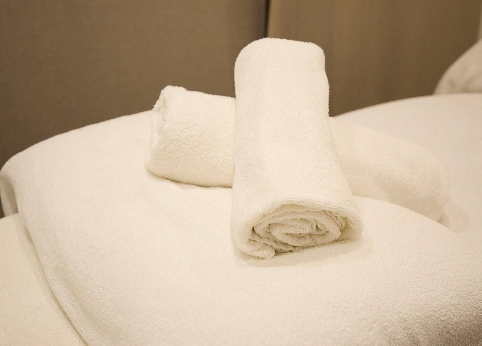 Fresh white towels elegantly placed at Elena Massage & Bodywork, Paddington, New South Wales, AU.